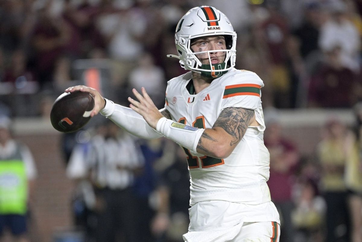 Oct 4, 2025; Tallahassee, Florida, USA; Miami Hurricanes quarterback Carson Beck (11) throws during the second half against the Florida State Seminoles at Doak S. Campbell Stadium. Mandatory Credit: Melina Myers-Imagn Images