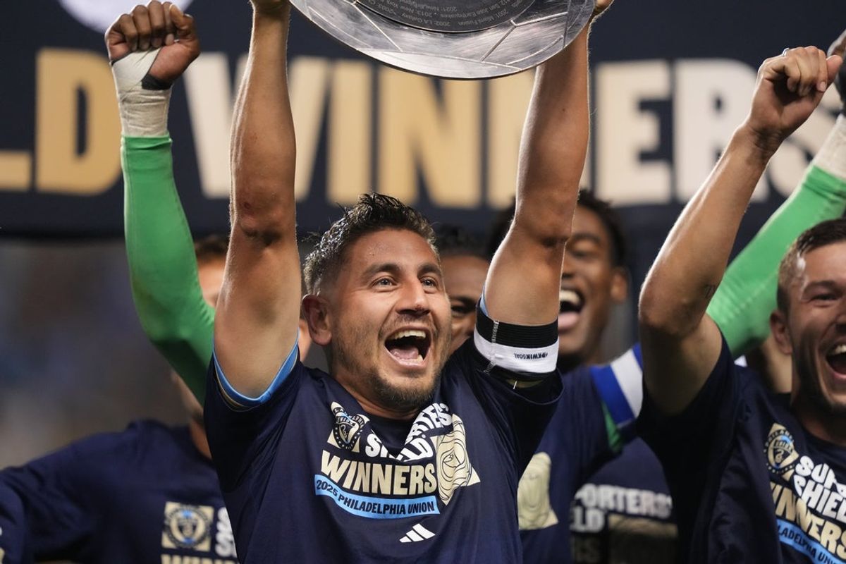 Oct 4, 2025; Chester, Pennsylvania, USA; Philadelphia Union midfielder Alejandro Bedoya (11) celebrates with the 2025 Supporters' Shield Trophy after the game against New York City FC at Subaru Park. Mandatory Credit: Kyle Ross-Imagn Images