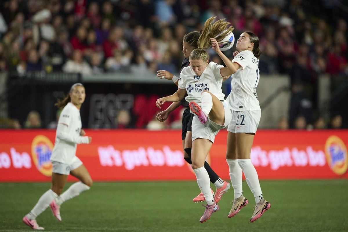 Oct 4, 2025; Portland, Oregon, USA; Portland Thorns FC forward Pietra Tordin (19) battles for a header against Bay FC midfielder Jamie Shepherd (14) and defender Brooklyn Courtnall (22) during the first half at Providence Park. Mandatory Credit: Troy Wayrynen-Imagn Images