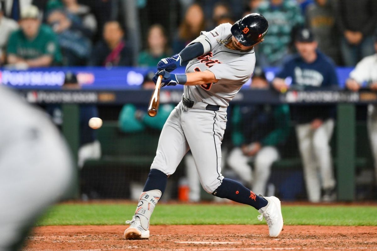 Oct 4, 2025; Seattle, Washington, USA; Detroit Tigers third baseman Zach McKinstry (39) hits an RBI single in the eleventh inning against the Seattle Mariners during game one of the ALDS round for the 2025 MLB playoffs at T-Mobile Park. Mandatory Credit: Steven Bisig-Imagn Images