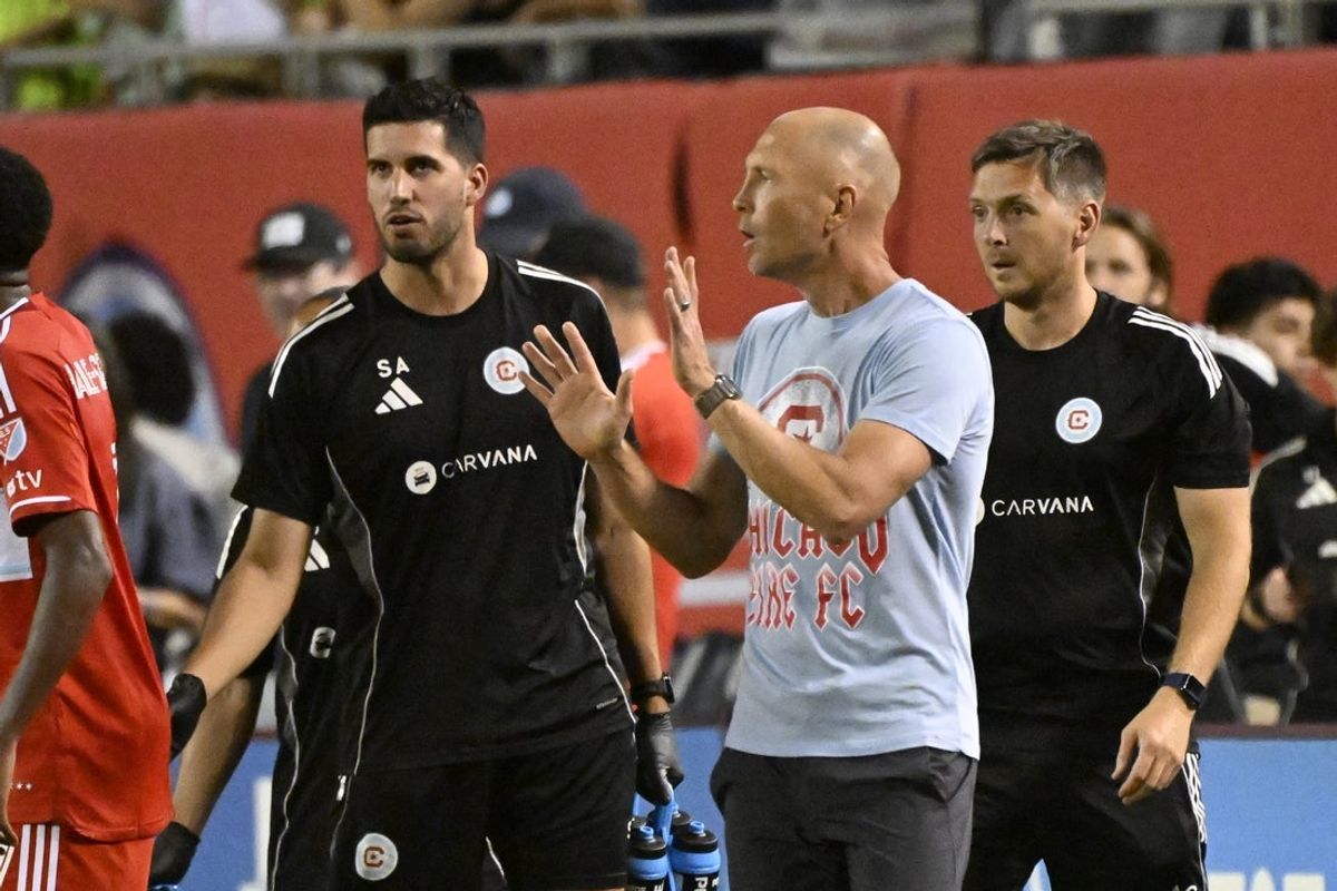 Oct 4, 2025; Chicago, Illinois, USA; Chicago Fire head coach Gregg Berhalter talks with players during the game against Toronto FC at Soldier Field. Mandatory Credit: Matt Marton-Imagn Images