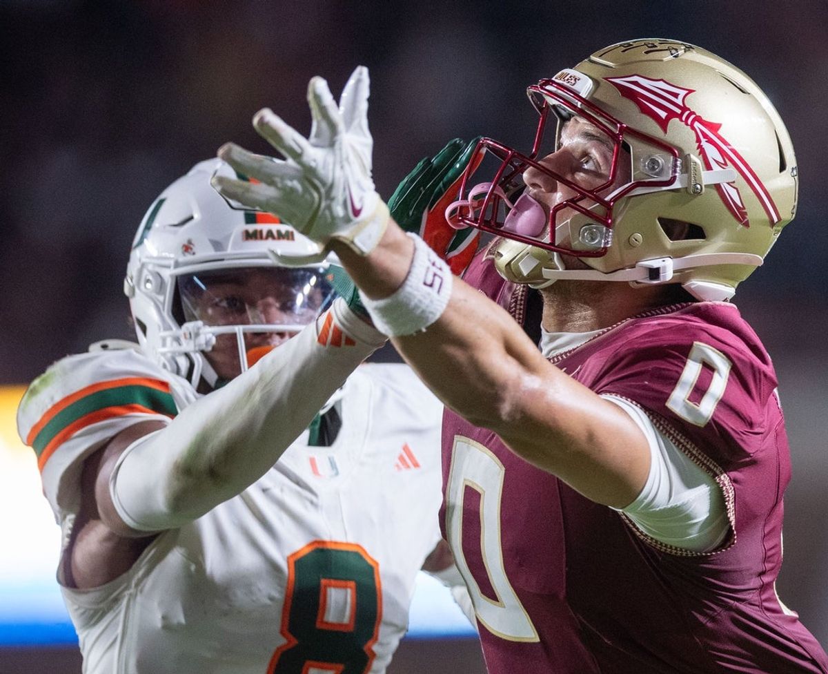 Florida State Seminoles wide receiver Duce Robinson (0) reaches for the ball in the end zone. The Miami Hurricanes defeated the Florida State Seminoles 22-28 at Doak Campbell Stadium on Saturday, Oct. 4, 2025.