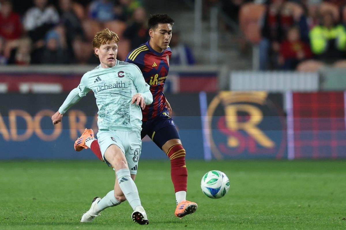 Oct 4, 2025; Sandy, Utah, USA; Colorado Rapids midfielder Oliver Larraz (8) passes the ball away from Real Salt Lake forward Tyler Wolff (16) during the second half at America First Field. Mandatory Credit: Rob Gray-Imagn Images