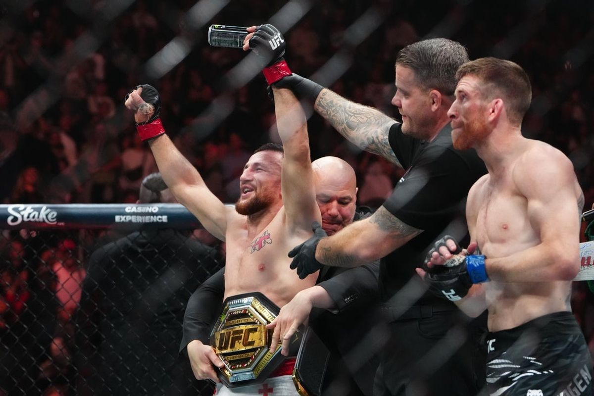 Oct 4, 2025; Las Vegas, Nevada, UNITED STATES; Merab Dvalishvili (red gloves) reacts after the fight against Cory Sandhagen (blue gloves) during UFC 320 at T-Mobile Arena. Mandatory Credit: Stephen R. Sylvanie-Imagn Images