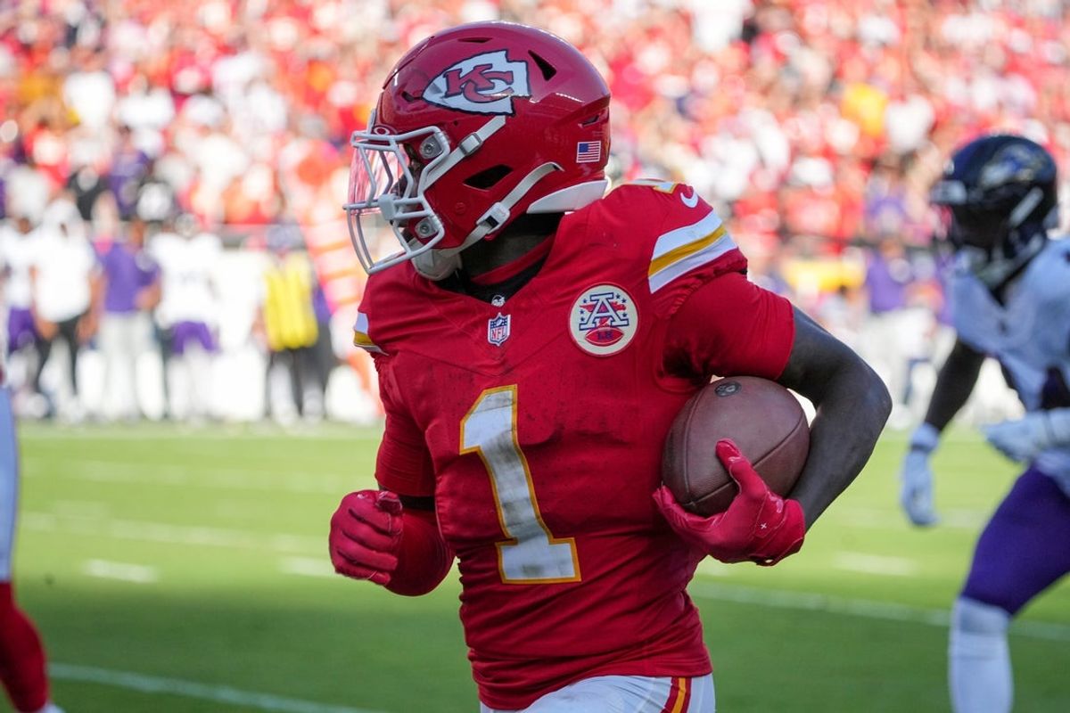 Sep 28, 2025; Kansas City, Missouri, USA; Kansas City Chiefs wide receiver Xavier Worthy (1) runs the ball against the Baltimore Ravens during the game at GEHA Field at Arrowhead Stadium. Mandatory Credit: Denny Medley-Imagn Images