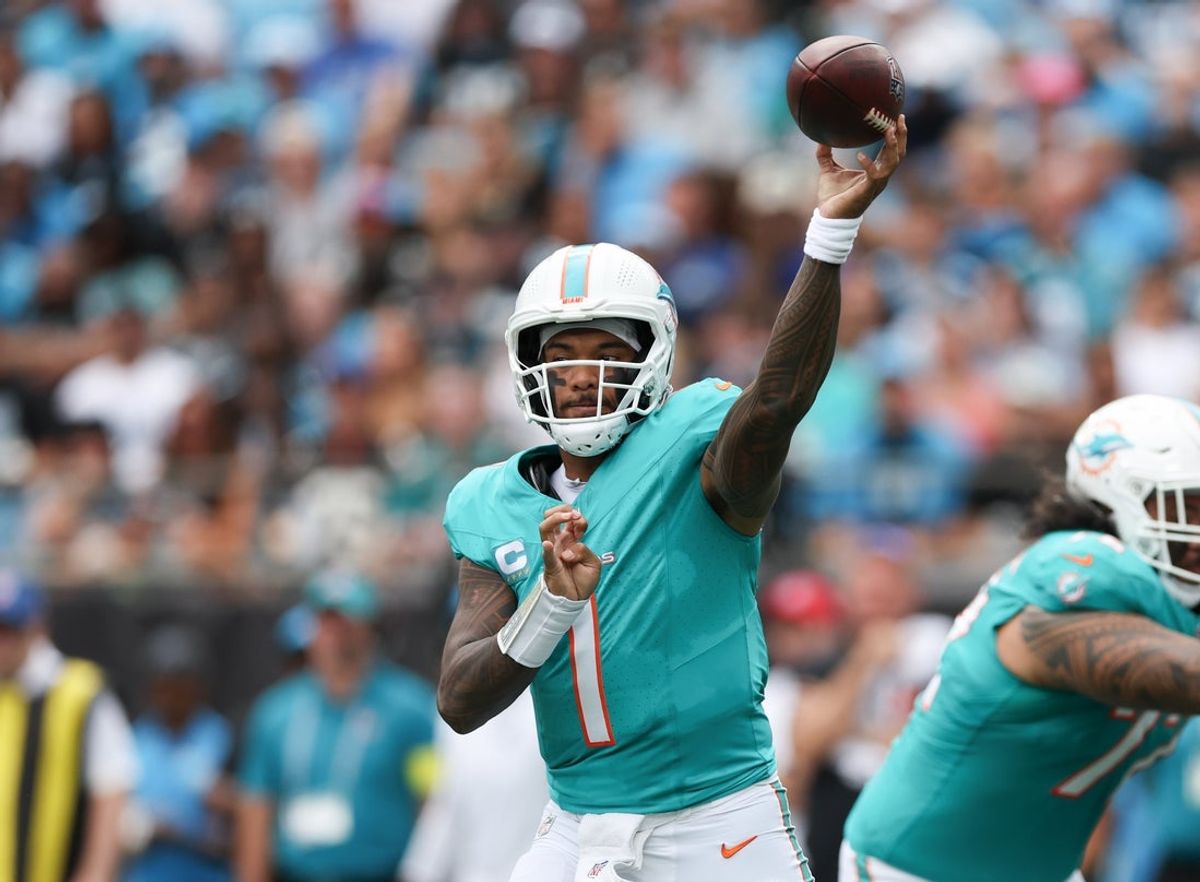 Oct 5, 2025; Charlotte, North Carolina, USA; Miami Dolphins quarterback Tua Tagovailoa (1) throws a pass during the second quarter against the Carolina Panthers at Bank of America Stadium. Mandatory Credit: Cory Knowlton-Imagn Images
