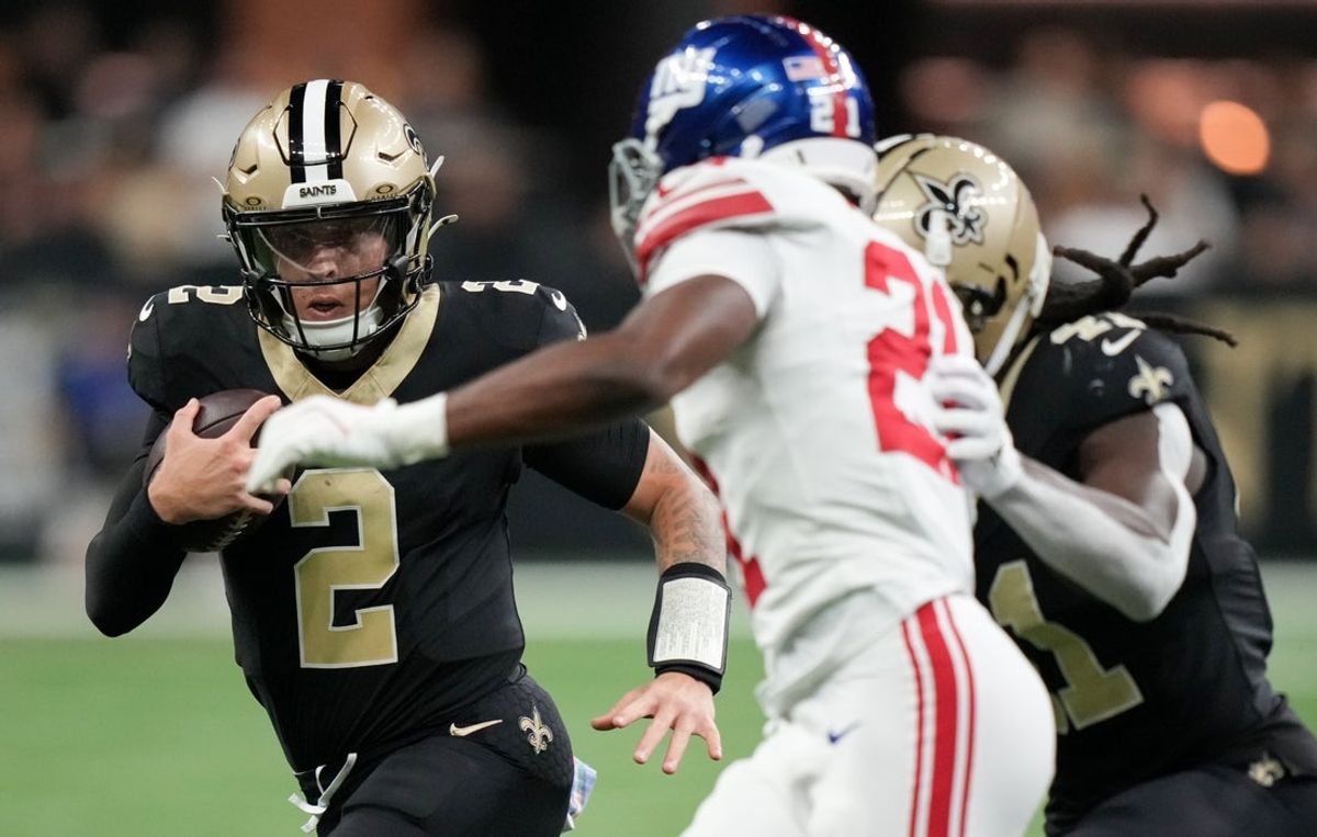 Oct 5, 2025; New Orleans, Louisiana, USA; New Orleans Saints quarterback Spencer Rattler (2) runs the ball against the New York Giants during the second quarter at Caesars Superdome. Mandatory Credit: Matthew Hinton-Imagn Images
