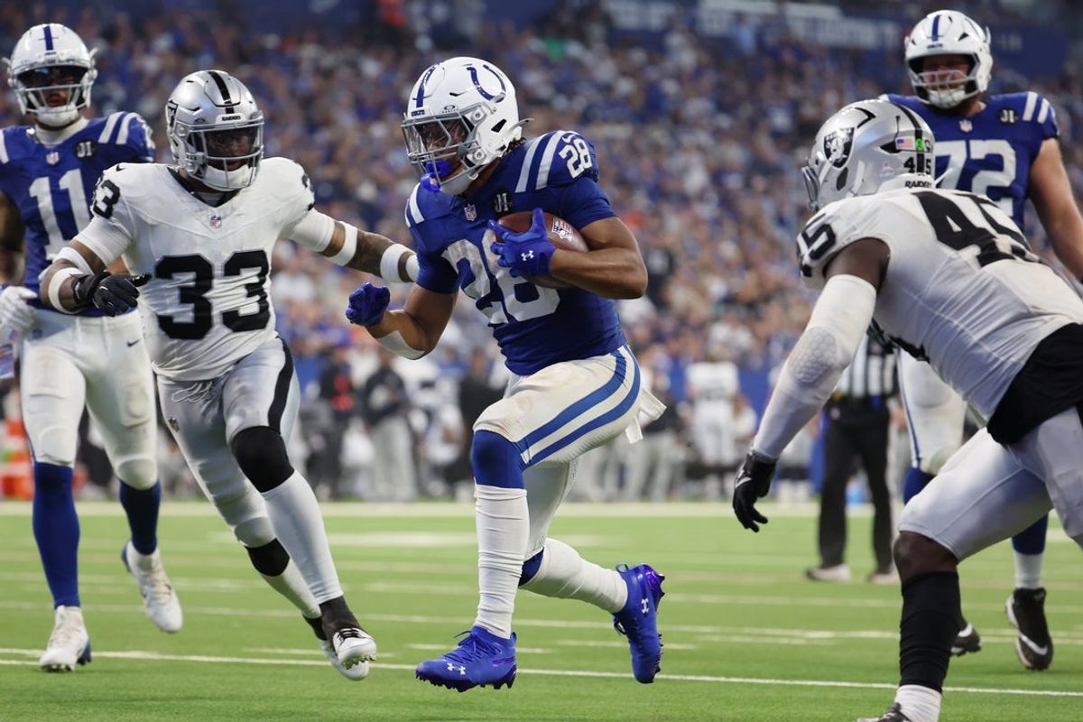 Oct 5, 2025; Indianapolis, Indiana, USA; Indianapolis Colts running back Jonathan Taylor (28) scores a touchdown against the Las Vegas Raiders during the second half at Lucas Oil Stadium. Mandatory Credit: Trevor Ruszkowski-Imagn Images