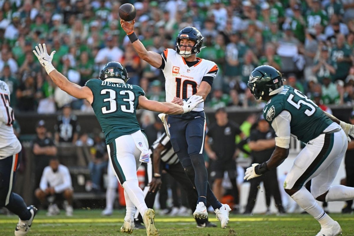 Oct 5, 2025; Philadelphia, Pennsylvania, USA; Denver Broncos quarterback Bo Nix (10) throws a pass order Philadelphia Eagles cornerback Cooper Dejean (33) during the fourth quarter at Lincoln Financial Field. Mandatory Credit: Eric Hartline-Imagn Images