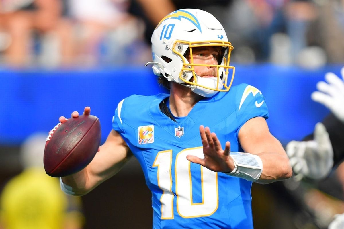 Oct 5, 2025; Inglewood, California, USA; Los Angeles Chargers quarterback Justin Herbert (10) throws a pass against the Washington Commanders in the second half at SoFi Stadium. Mandatory Credit: Gary A. Vasquez-Imagn Images
