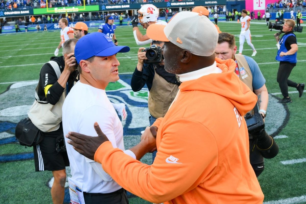Oct 5, 2025; Seattle, Washington, USA; Seattle Seahawks head coach Mike MacDonald and Tampa Bay Buccaneers head coach Todd Bowles shake hands following the game at Lumen Field. Mandatory Credit: Steven Bisig-Imagn Images