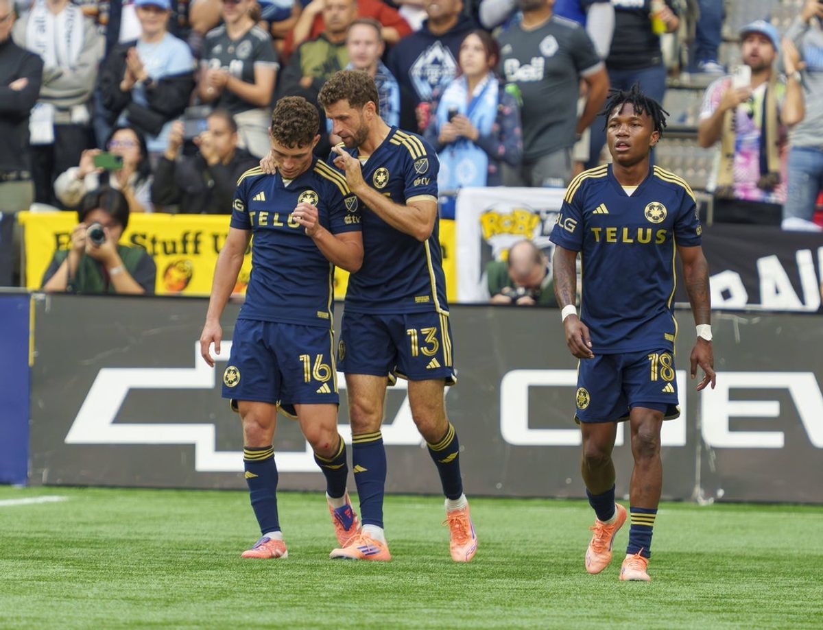 Oct 5, 2025; Vancouver, British Columbia, CAN; Vancouver Whitecaps FC midfielder Thomas Muller (13) congratulates teammate midfielder Sebastian Berhalter (16) on his goal against the San Jose Earthquakes in the second half at BC Place. Mandatory Credit: Christopher Morris-Imagn Images