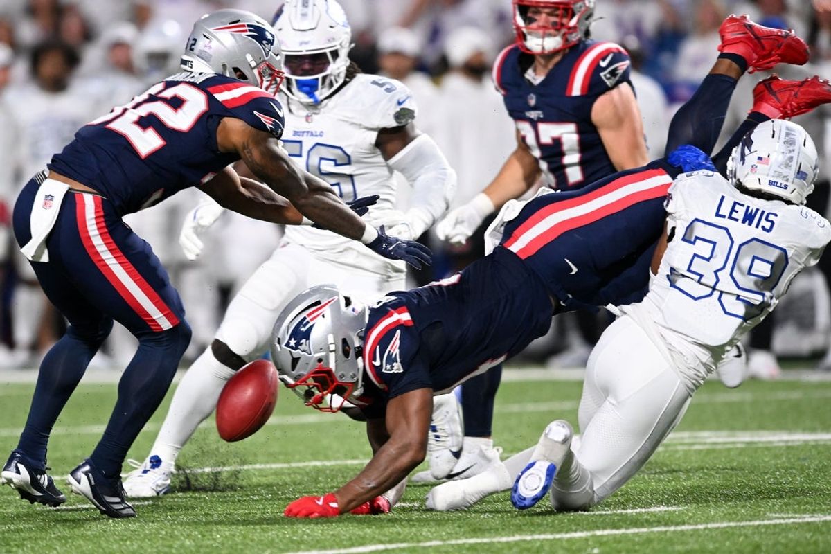Oct 5, 2025; Orchard Park, New York, USA; Buffalo Bills cornerback Cam Lewis (39) tackles New England Patriots running back Antonio Gibson (4) to fumble during the first half at Highmark Stadium. Mandatory Credit: Mark Konezny-Imagn Images