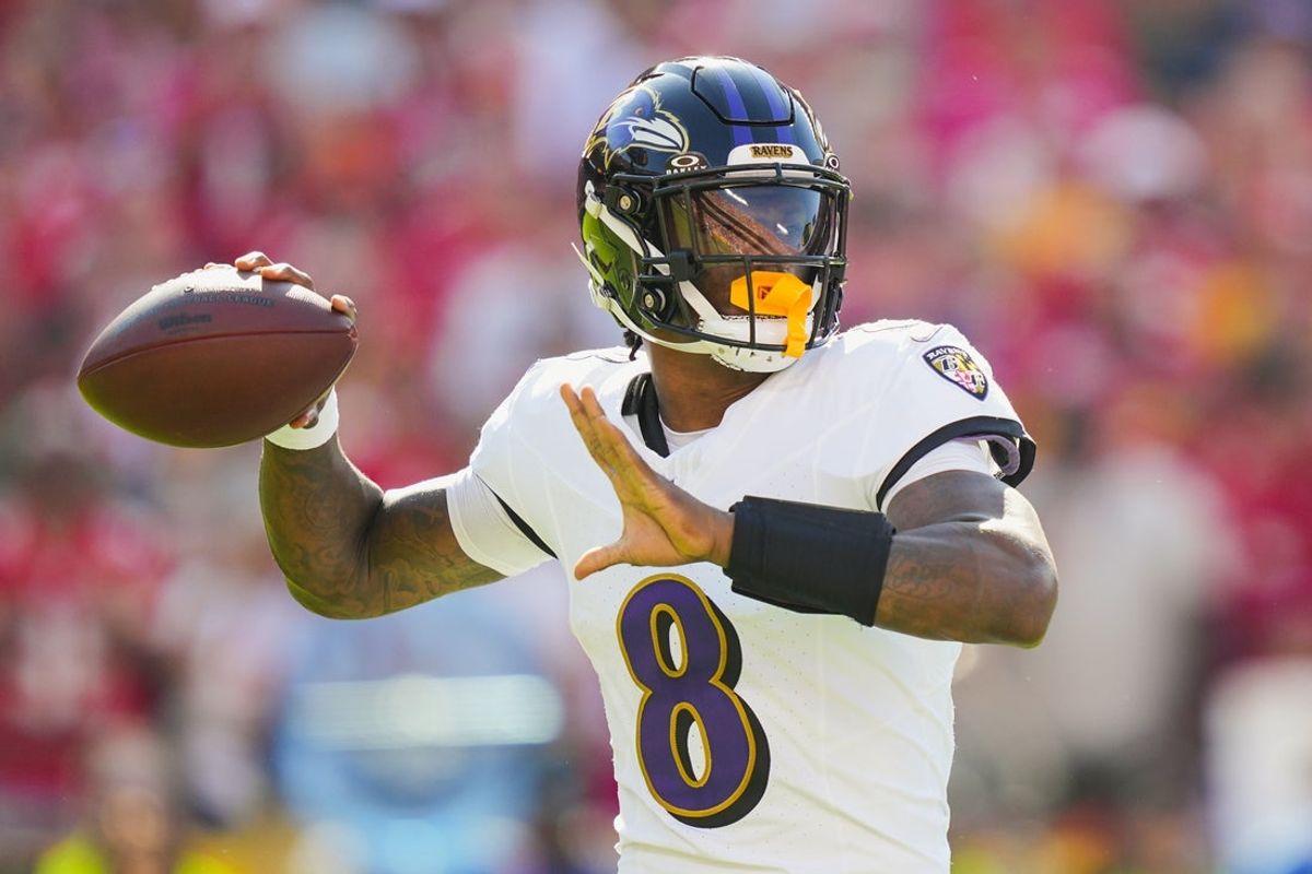 Sep 28, 2025; Kansas City, Missouri, USA; Baltimore Ravens quarterback Lamar Jackson (8) throws a pass during the first half against the Kansas City Chiefs at GEHA Field at Arrowhead Stadium. Mandatory Credit: Jay Biggerstaff-Imagn Images