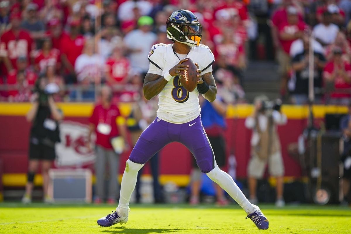 Sep 28, 2025; Kansas City, Missouri, USA; Baltimore Ravens quarterback Lamar Jackson (8) drops back to pass during the first half against the Kansas City Chiefs at GEHA Field at Arrowhead Stadium. Mandatory Credit: Jay Biggerstaff-Imagn Images