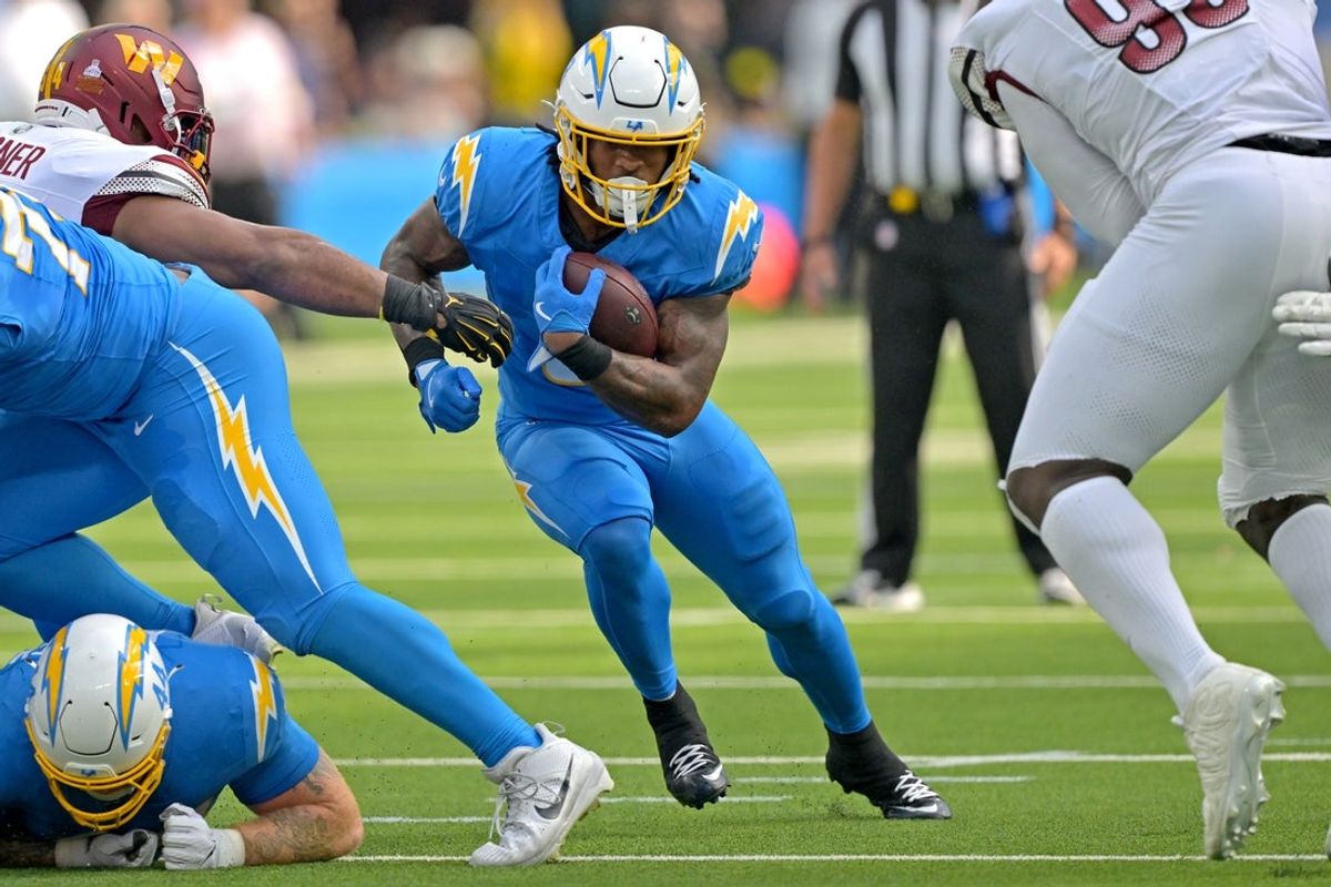 Oct 5, 2025; Inglewood, California, USA; Los Angeles Chargers running back Omarion Hampton (8) carries the ball against the Washington Commanders at SoFi Stadium. Mandatory Credit: Jayne Kamin-Oncea-Imagn Images