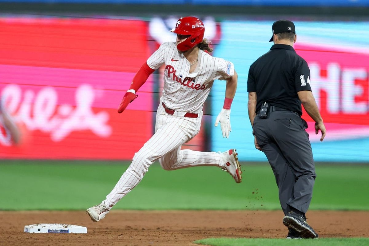 Oct 6, 2025; Philadelphia, Pennsylvania, USA; Philadelphia Phillies third baseman Alec Bohm (28) rounds second base on this way to third against the Los Angeles Dodgers in the ninth inning during game two of the NLDS round for the 2025 MLB playoffs at Citizens Bank Park. Mandatory Credit: Bill Streicher-Imagn Images