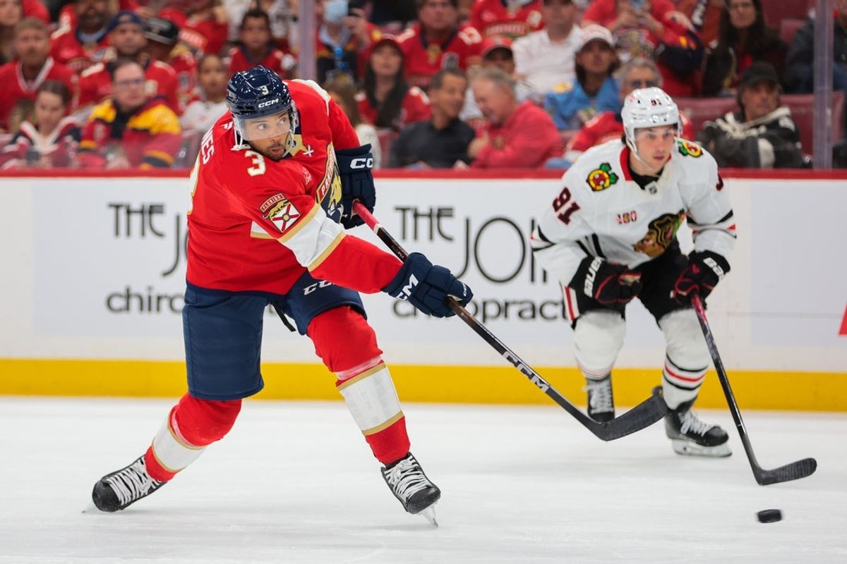 Oct 7, 2025; Sunrise, Florida, USA; Florida Panthers defenseman Seth Jones (3) shoots the puck against the Chicago Blackhawks during the first period at Amerant Bank Arena. Mandatory Credit: Sam Navarro-Imagn Images