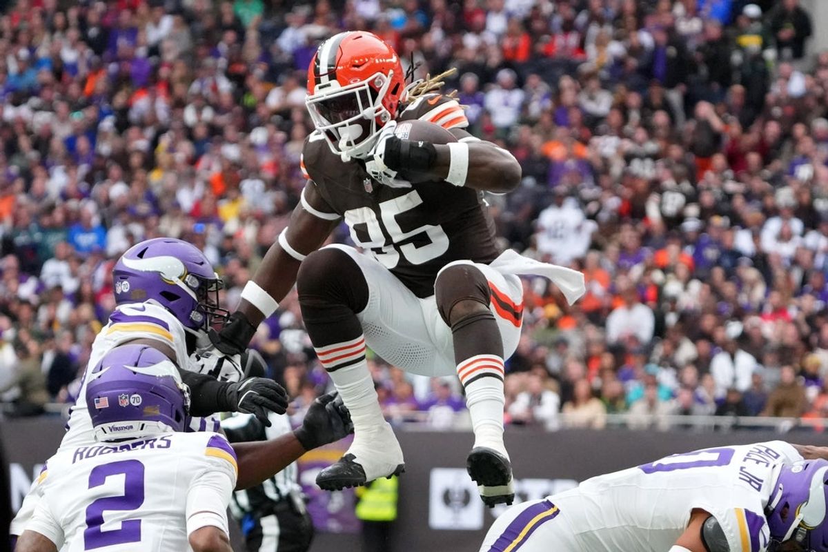 Oct 5, 2025; Tottenham, United Kingdom; Cleveland Browns tight end David Njoku (85) leaps over Minnesota Vikings linebacker Ivan Pace Jr. (0) during the third quarter of an NFL International Series game at Tottenham Hotspur Stadium. Mandatory Credit: Kirby Lee-Imagn Images