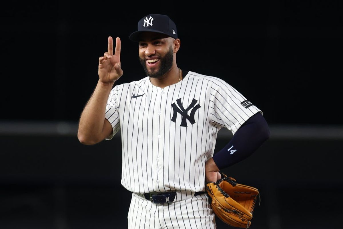 Oct 7, 2025; Bronx, New York, USA; New York Yankees third baseman Amed Rosario (14) celebrates during the Aaron Judge (99) (not pictured) home run in the fourth inning against the Toronto Blue Jays during game three of the ALDS round for the 2025 MLB playoffs at Yankee Stadium. Mandatory Credit: Vincent Carchietta-Imagn Images
