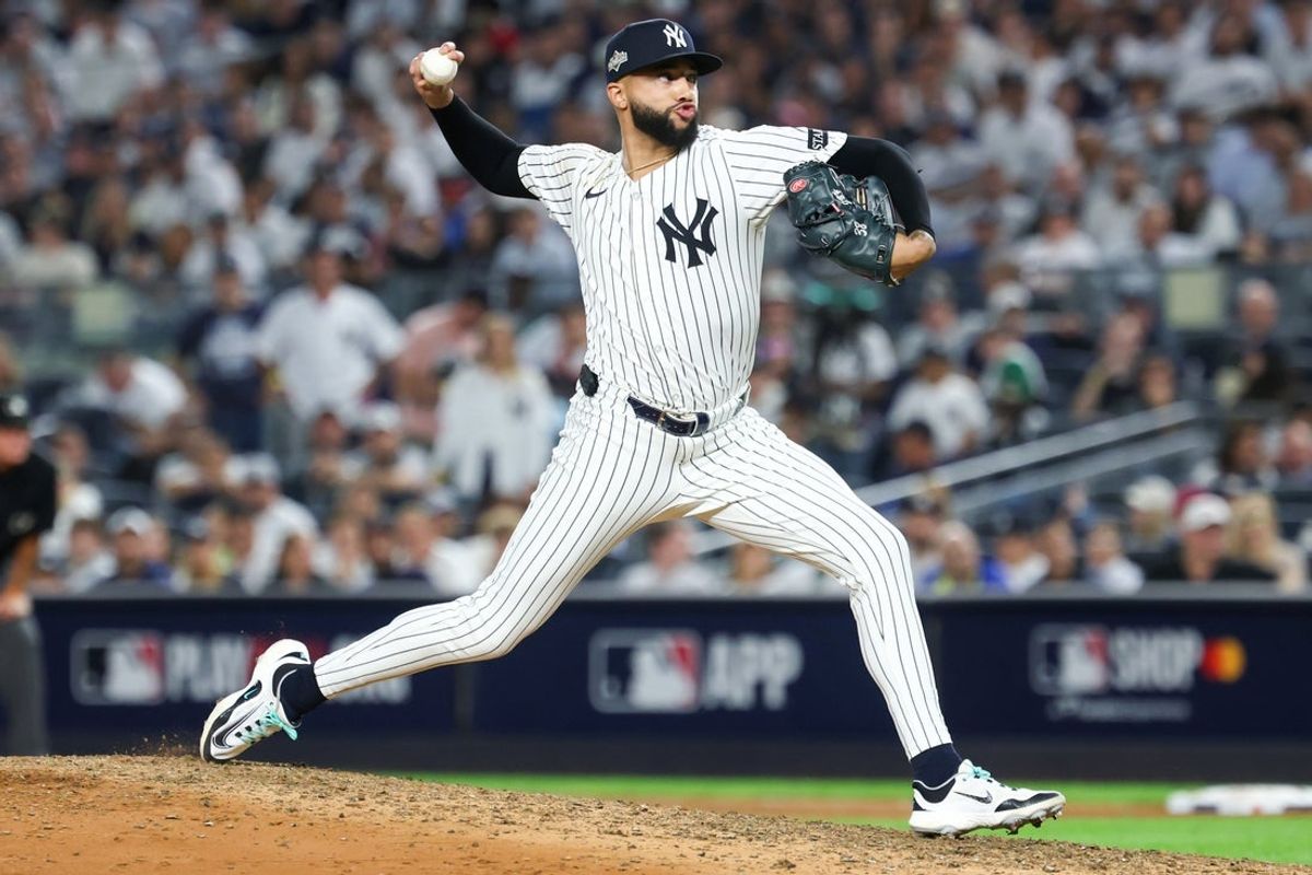 Oct 7, 2025; Bronx, New York, USA; New York Yankees relief pitcher Devin Williams (38) delivers a pitch in the seventh inning against the Toronto Blue Jays during game three of the ALDS round for the 2025 MLB playoffs at Yankee Stadium. Mandatory Credit: Vincent Carchietta-Imagn Images