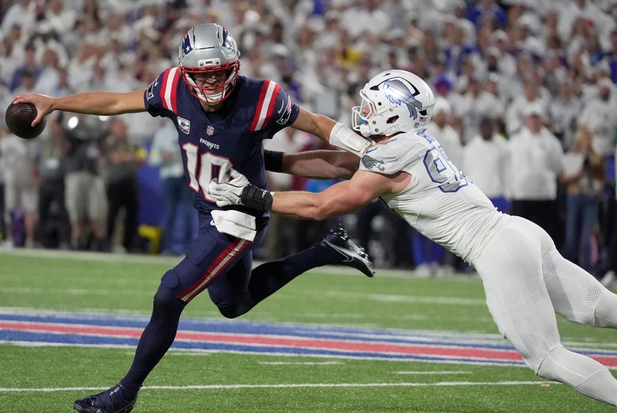New England Patriots quarterback Drake Maye is forced out of bounds by Buffalo Bills defensive end Joey Bosa during second half action at Highmark Stadium in Orchard Park on Oct. 5, 2025.