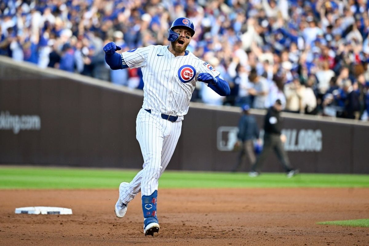 Oct 8, 2025; Chicago, Illinois, USA; Chicago Cubs first baseman Michael Busch (29) celebrates while rounds the bases after hitting a solo home run against the Milwaukee Brewers in the first inning during game three of the NLDS round for the 2025 MLB playoffs at Wrigley Field. Mandatory Credit: Matt Marton-Imagn Images
