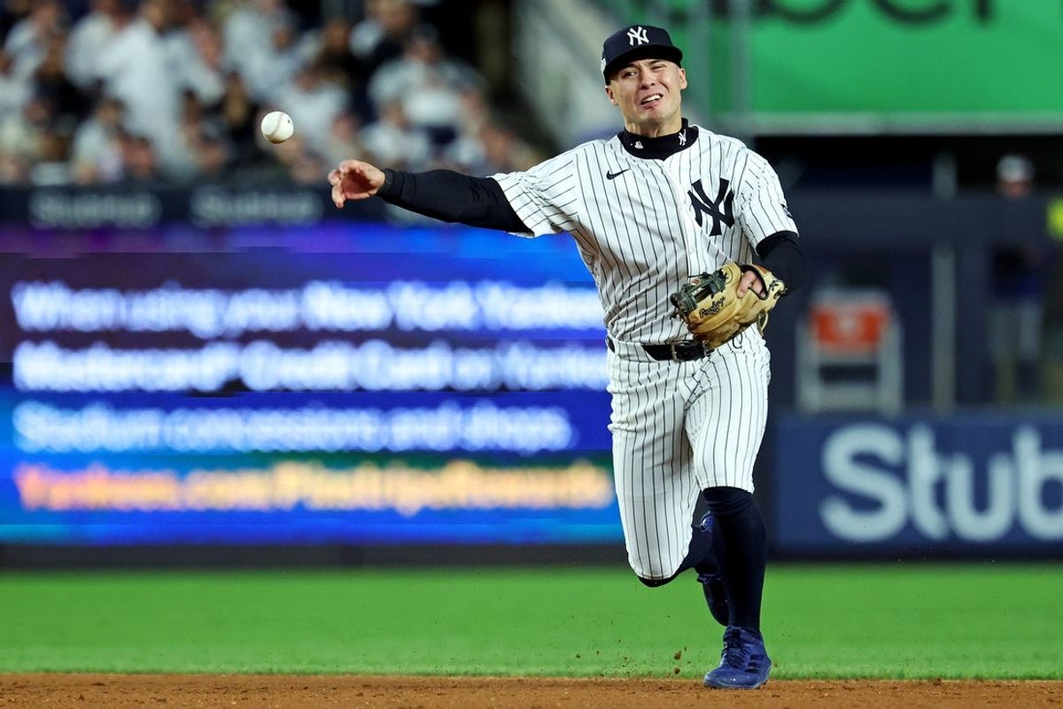 Oct 8, 2025; Bronx, New York, USA; New York Yankees shortstop Anthony Volpe (11) throws to first base for an out during the third inning against the Toronto Blue Jays during game four of the ALDS round for the 2025 MLB playoffs at Yankee Stadium. Mandatory Credit: Vincent Carchietta-Imagn Images