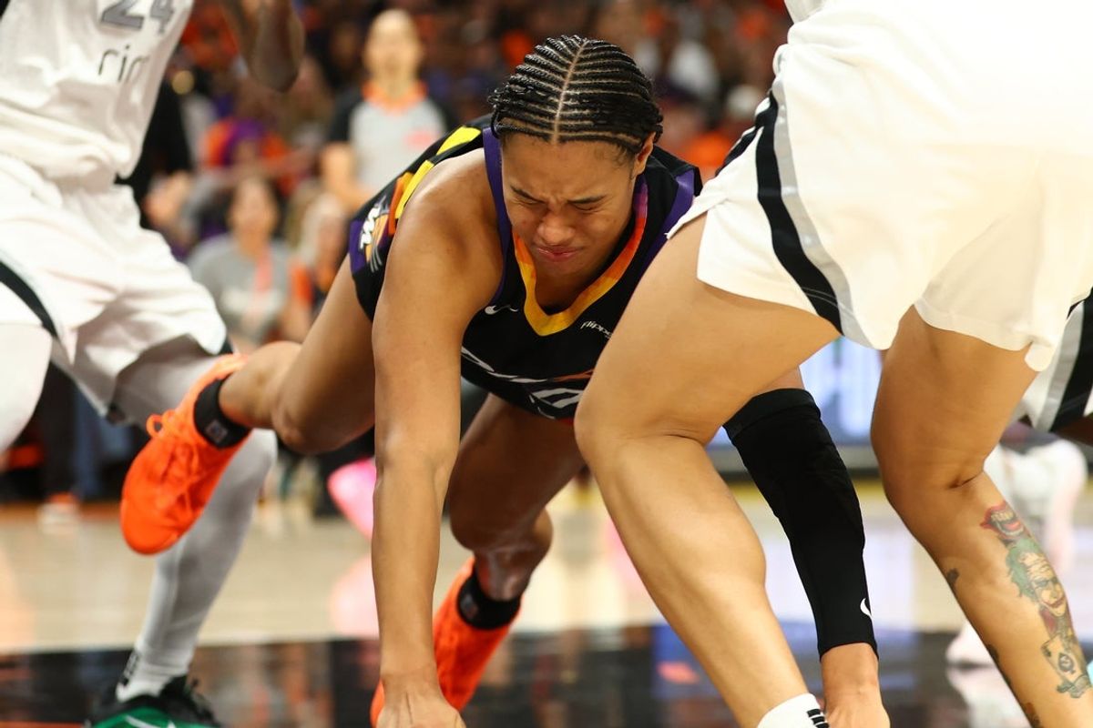 Oct 8, 2025; Phoenix, Arizona, USA; Phoenix Mercury forward Satou Sabally (0) falls to the ground against the Las Vegas Aces in the second half during game three of the 2025 WNBA Finals at PHX Arena. Mandatory Credit: Mark J. Rebilas-Imagn Images