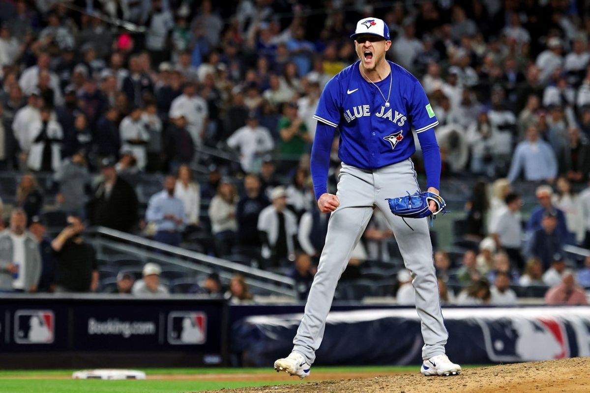 Oct 8, 2025; Bronx, New York, USA; Toronto Blue Jays pitcher Jeff Hoffman (23) celebrates getting the last out to win the ALDS round for the 2025 MLB playoffs against the New York Yankees at Yankee Stadium. Mandatory Credit: Vincent Carchietta-Imagn Images