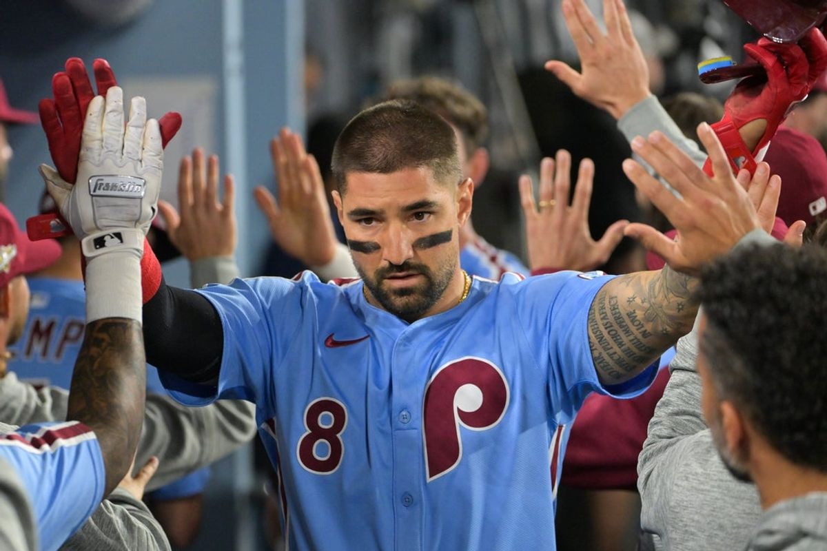 Oct 8, 2025; Los Angeles, California, USA; Philadelphia Phillies right fielder Nick Castellanos (8) celebrates after scoring a run during the eighth inning against the Los Angeles Dodgers during game three of the NLDS round for the 2025 MLB playoffs at Dodger Stadium. Mandatory Credit: Jayne Kamin-Oncea-Imagn Images