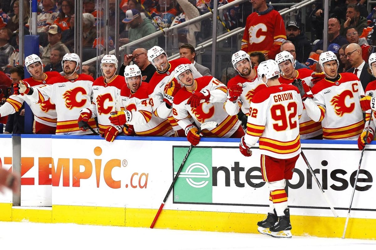 Oct 8, 2025; Edmonton, Alberta, CAN; The Calgary Flames celebrate a goal scored by defensemen Maceo Phillips (92) during the second period against the Edmonton Oilers at Rogers Place. Mandatory Credit: Perry Nelson-Imagn Images