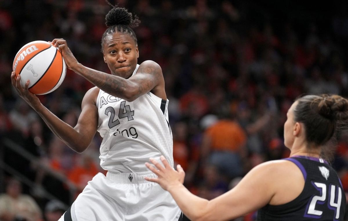 Las Vegas Aces guard Jewell Loyd (24) grabs a rebound over Phoenix Mercury forward Kathryn Westbeld (24) during Game 3 of the WNBA Finals at Mortgage Matchup Center in Phoenix on Oct. 8, 2025.