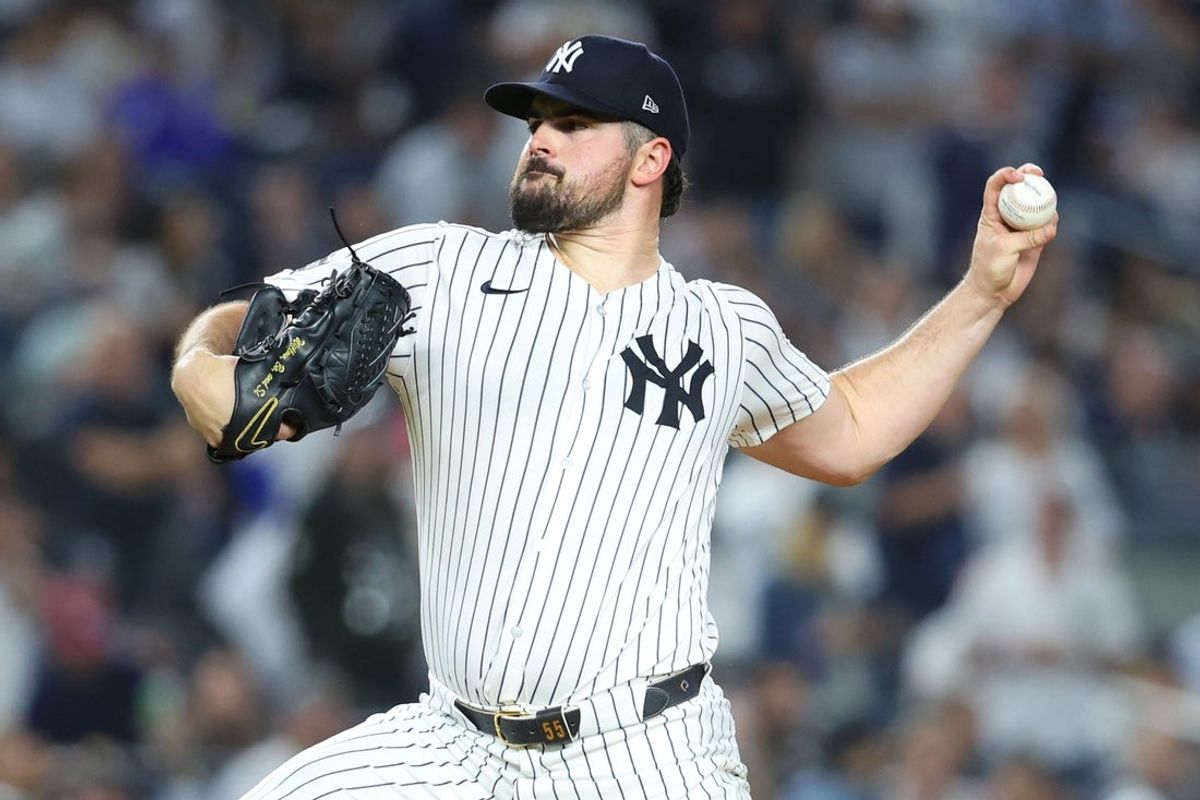 Oct 7, 2025; Bronx, New York, USA; New York Yankees starting pitcher Carlos Rodon (55) pitches against the Toronto Blue Jays in the first inning during game three of the ALDS round for the 2025 MLB playoffs at Yankee Stadium. Mandatory Credit: Wendell Cruz-Imagn Images