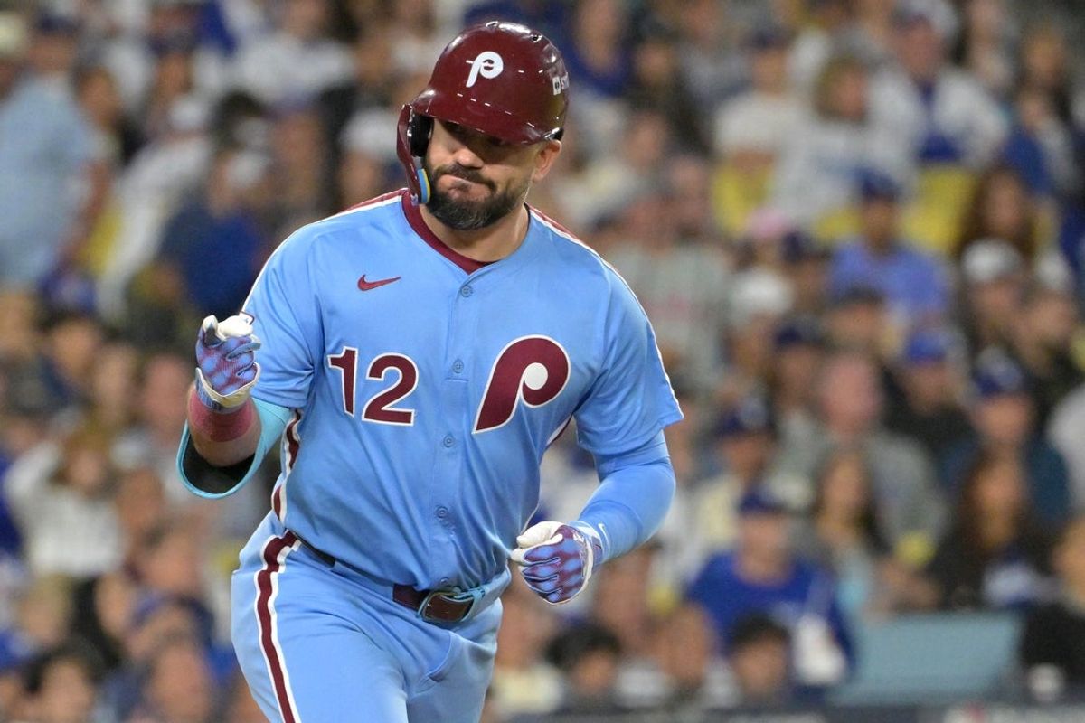 Oct 8, 2025; Los Angeles, California, USA; Philadelphia Phillies designated hitter Kyle Schwarber (12) looks into the dugout after hitting a solo home run during the fourth inning against the Los Angeles Dodgers in game three of the NLDS during the 2025 MLB playoffs at Dodger Stadium. Mandatory Credit: Jayne Kamin-Oncea-Imagn Images
