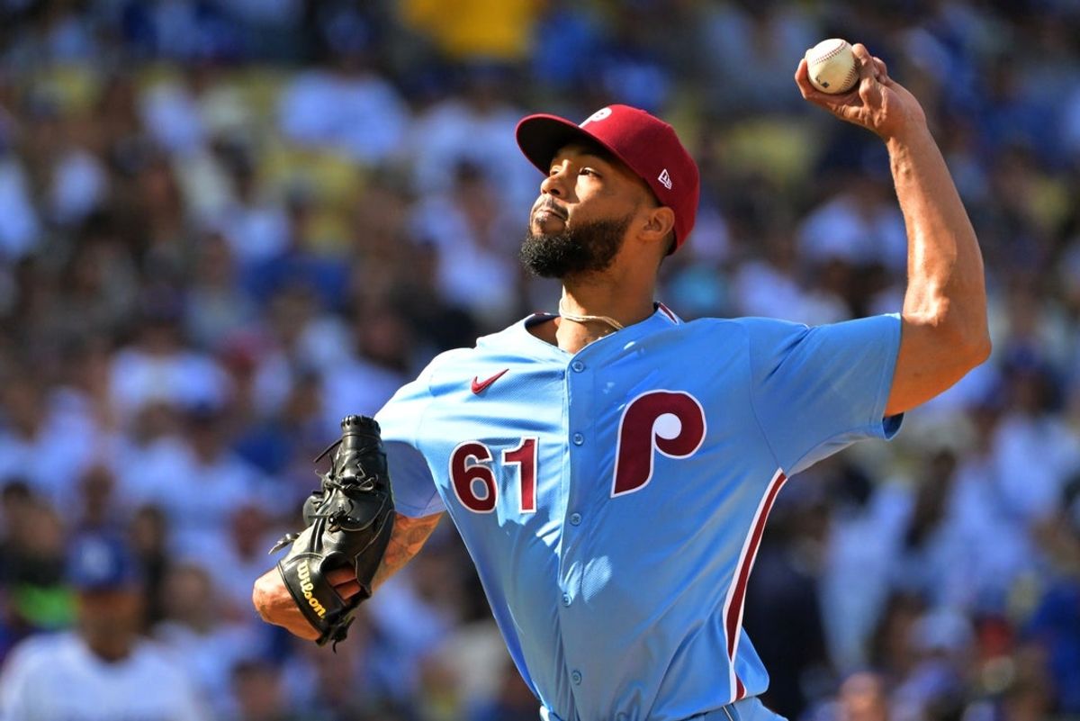 Oct 9, 2025; Los Angeles, California, USA; Philadelphia Phillies pitcher Cristopher Sanchez (61) throws in the first inning against the Los Angeles Dodgers during game four of the NLDS round for the 2025 MLB playoffs at Dodger Stadium. Mandatory Credit: Jayne Kamin-Oncea-Imagn Images