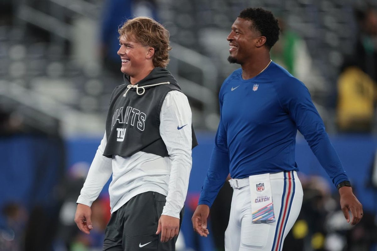 Oct 9, 2025; East Rutherford, New Jersey, USA; New York Giants quarterback Jaxson Dart, left, and quarterback Jameis Winston, right, on the field before the game against the Philadelphia Eagles at MetLife Stadium. Mandatory Credit: Vincent Carchietta-Imagn Images