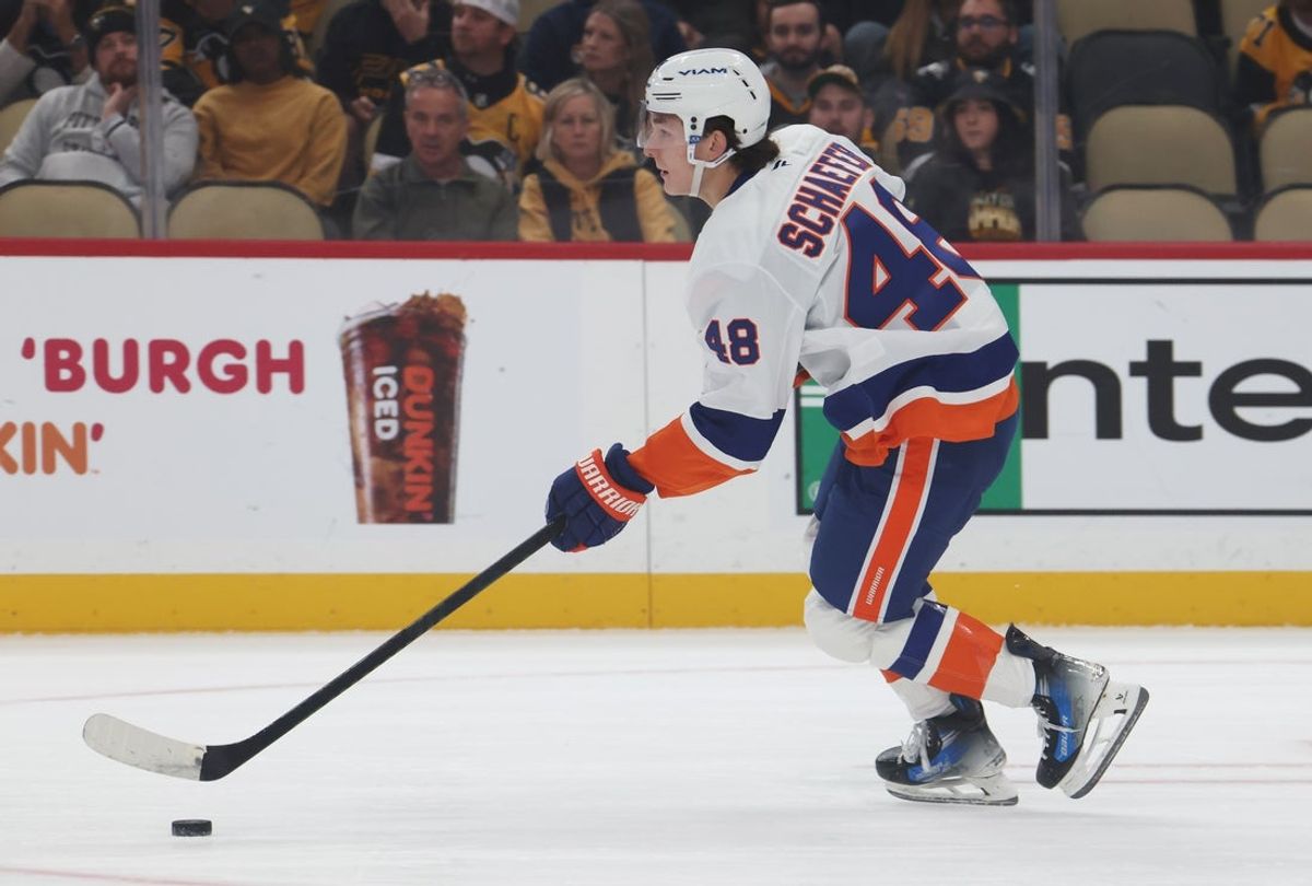 Oct 9, 2025; Pittsburgh, Pennsylvania, USA;  New York Islanders defenseman Matthew Schaefer (48) moves the puck in his NHL debut against the Pittsburgh Penguins during the first period at PPG Paints Arena. Mandatory Credit: Charles LeClaire-Imagn Images