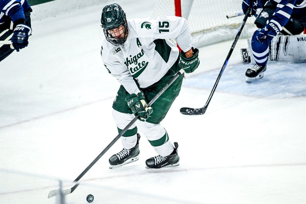 Michigan State's Charlie Stramel moves the puck against New Hampshire during the second period on Thursday, Oct. 9, 2025, at Munn Ice Arena in East Lansing.