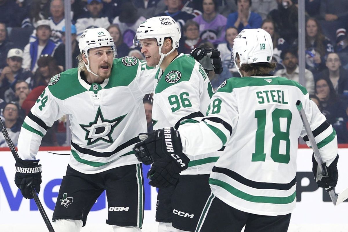 Oct 9, 2025; Winnipeg, Manitoba, CAN; Dallas Stars right wing Mikko Rantanen (96) celebrates his goal with Dallas Stars center Roope Hintz (24) and Dallas Stars center Sam Steel (18) against the Winnipeg Jets in the first period at Canada Life Centre. Mandatory Credit: James Carey Lauder-Imagn Images