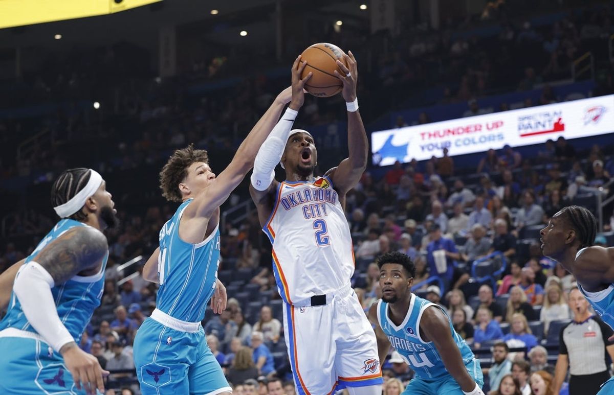 Oct 9, 2025; Oklahoma City, Oklahoma, USA; Oklahoma City Thunder guard Shai Gilgeous-Alexander (2) shoots against the Charlotte Hornets during the second quarter of a game between the Charlotte Hornets and the Oklahoma City Thunder at Paycom Center. Mandatory Credit: Alonzo Adams-Imagn Images