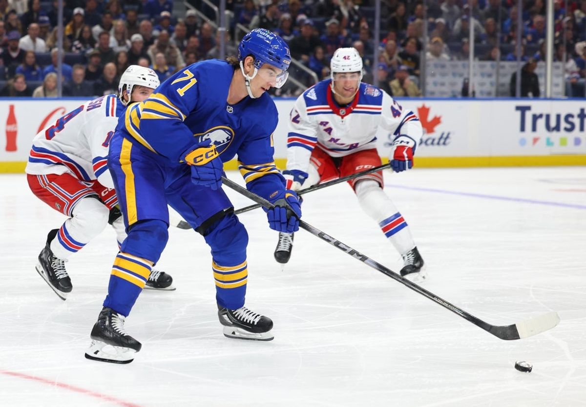 Oct 9, 2025; Buffalo, New York, USA;  Buffalo Sabres center Ryan McLeod (71) goes after a loose puck during the third period against the New York Rangers at KeyBank Center. Mandatory Credit: Timothy T. Ludwig-Imagn Images