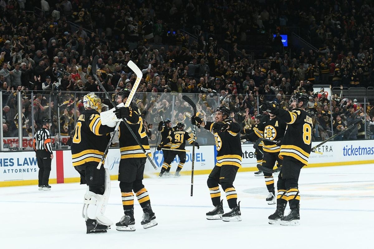 Oct 9, 2025; Boston, Massachusetts, USA; Boston Bruins goaltender Joonas Korpisalo (70) reacts with his teammates after defeating the Chicago Blackhawks in overtime at TD Garden. Mandatory Credit: Bob DeChiara-Imagn Images