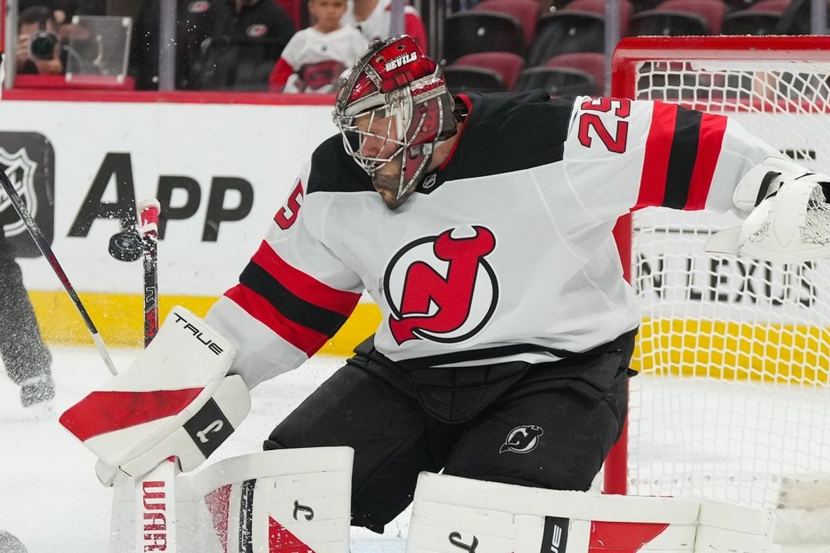 Oct 9, 2025; Raleigh, North Carolina, USA;  New Jersey Devils goaltender Jacob Markstrom (25) stops the shot against the Carolina Hurricanes during the during the third period at Lenovo Center. Mandatory Credit: James Guillory-Imagn Images