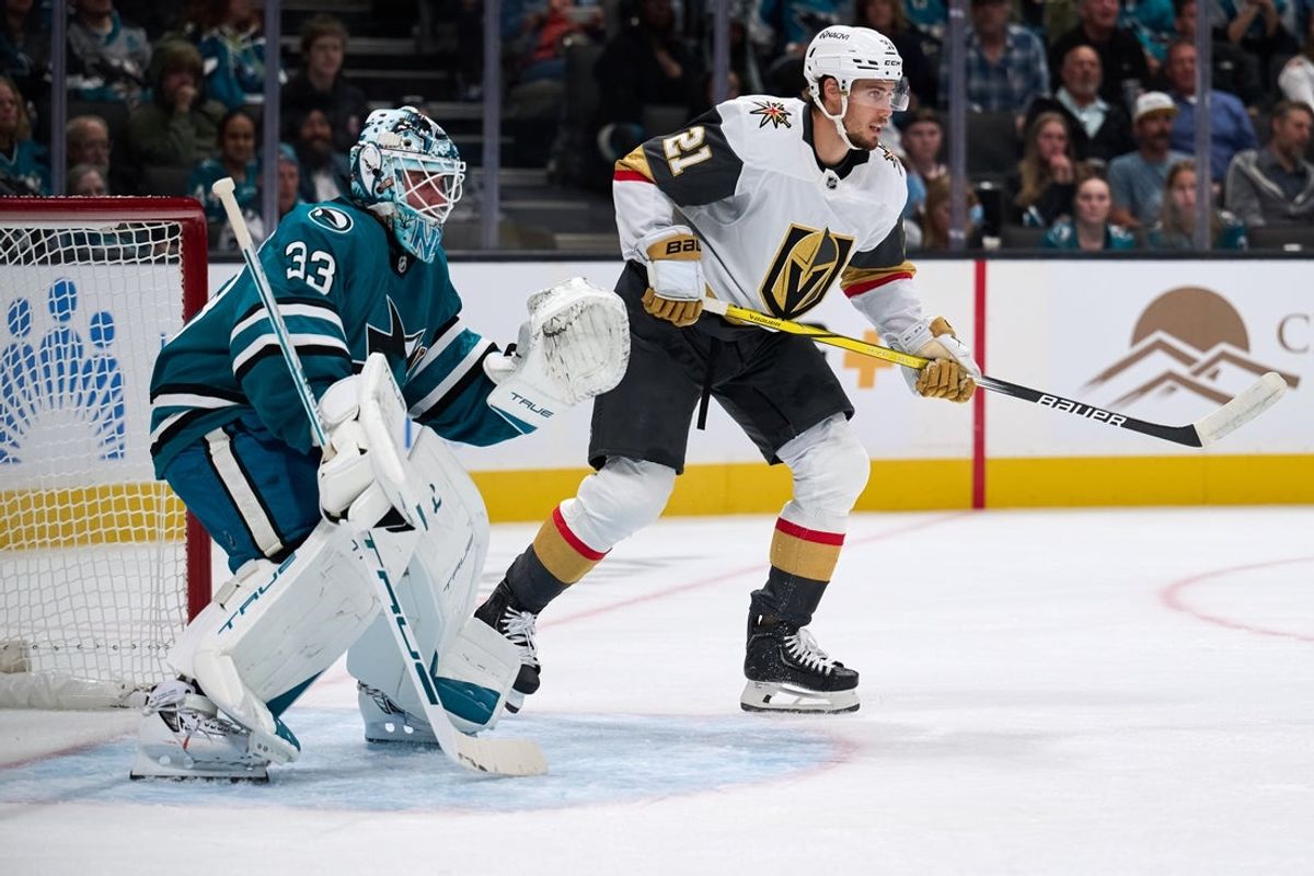 Oct 9, 2025; San Jose, California, USA; Vegas Golden Knights center Brett Howden (21) stands near the goal crease against San Jose Sharks goaltender Alex Nedeljkovic (33) during the first period at SAP Center at San Jose. Mandatory Credit: Robert Edwards-Imagn Images