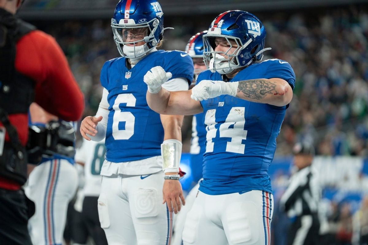 New York Giants running back Cam Skattebo (44) and New York Giants quarterback Jaxson Dart (6) celebrate after a touchdown during a Thursday Night Football game between the New York Giants and the Philadelphia Eagles at MetLife Stadium in East Rutherford on Oct. 9, 2025.