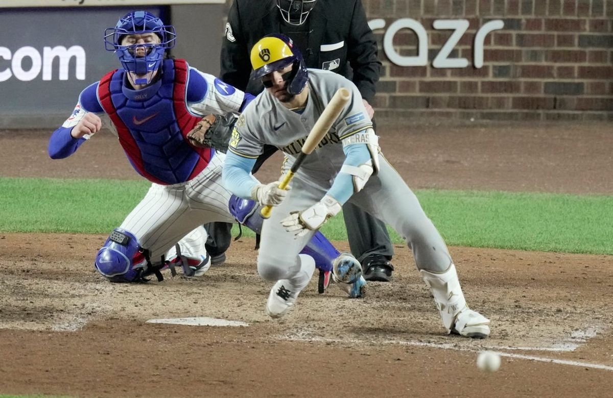 Oct 9, 2025; Chicago, Illinois, USA; Milwaukee Brewers catcher William Contreras (24) hits into a double play to end the eighth inning of their game against the Chicago Cubs during game four of the NLDS round for the 2025 MLB playoffs at Wrigley Field. Mandatory Credit: Mark Hoffman-USA TODAY Network via Imagn Images