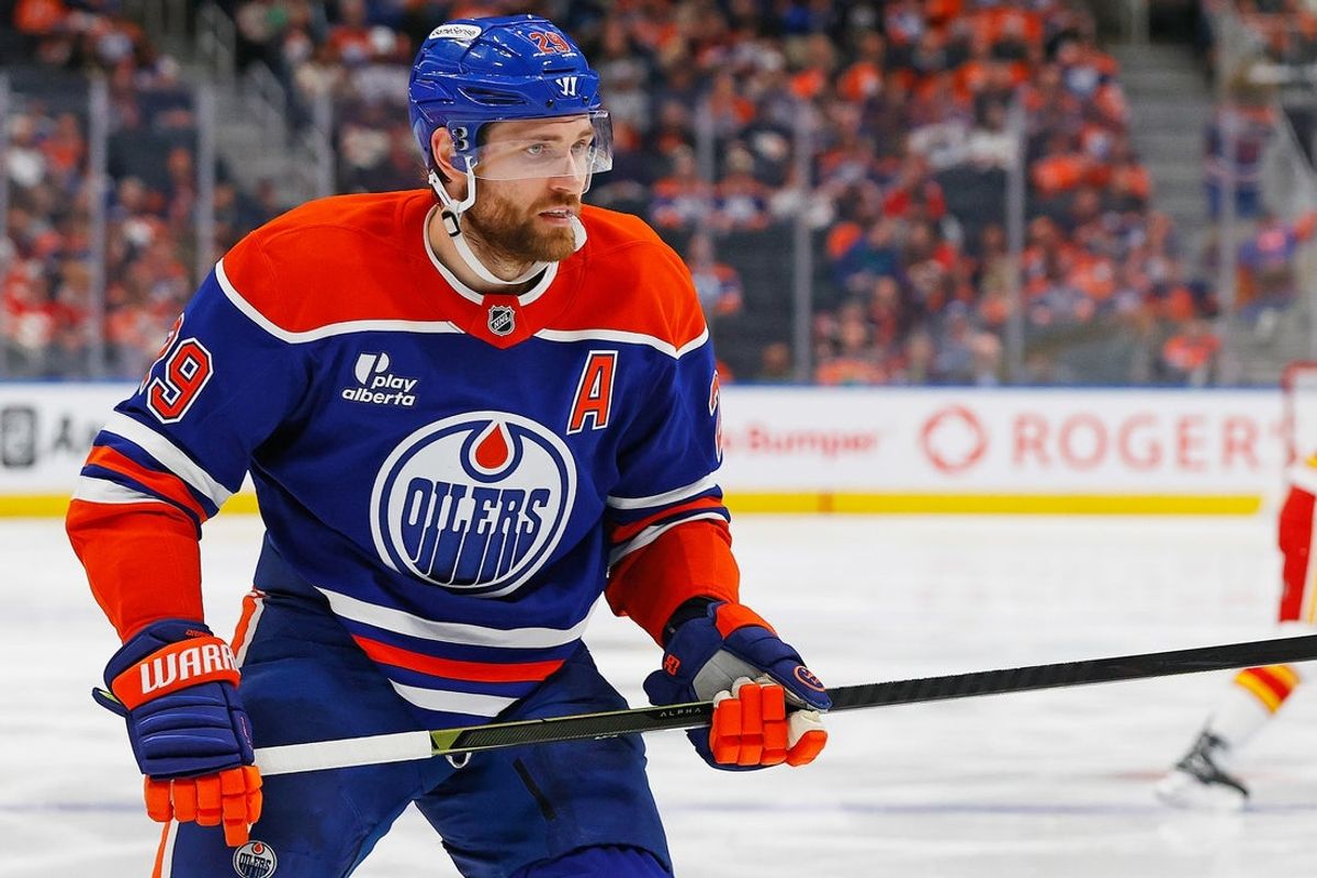 Oct 8, 2025; Edmonton, Alberta, CAN; Edmonton Oilers forward Leon Draisaitl (29) looks for a loose puck against the Calgary Flames at Rogers Place. Mandatory Credit: Perry Nelson-Imagn Images