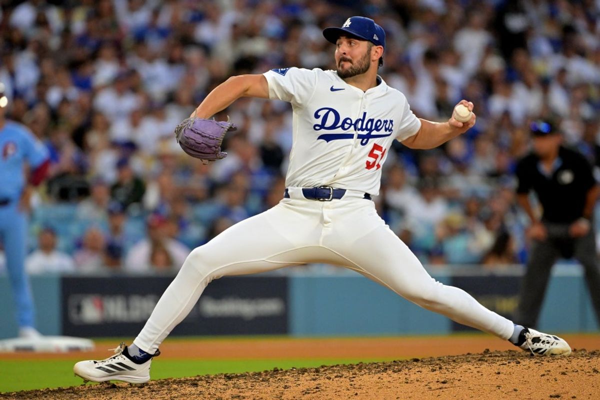 Oct 9, 2025; Los Angeles, California, USA; Los Angeles Dodgers pitcher Alex Vesia (51) delivers in the 11th inning of game four of the NLDS during the 2025 MLB playoffs against the Philadelphia Phillies at Dodger Stadium. Mandatory Credit: Jayne Kamin-Oncea-Imagn Images