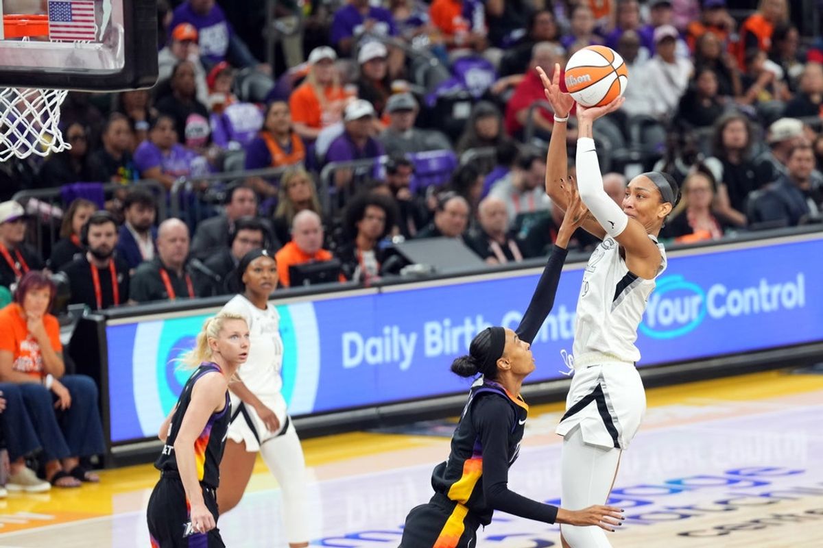 Oct 10, 2025; Phoenix, Arizona, USA; Las Vegas Aces center A'ja Wilson (22) shoots against the Phoenix Mercury during the first half of game four of the 2025 WNBA Finals at Mortgage Matchup Center. Mandatory Credit: Joe Camporeale-Imagn Images